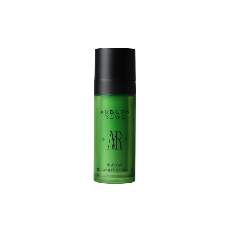 Green serum bottle with black cap on a white background, featuring the brand 'Auburn Rowe'.