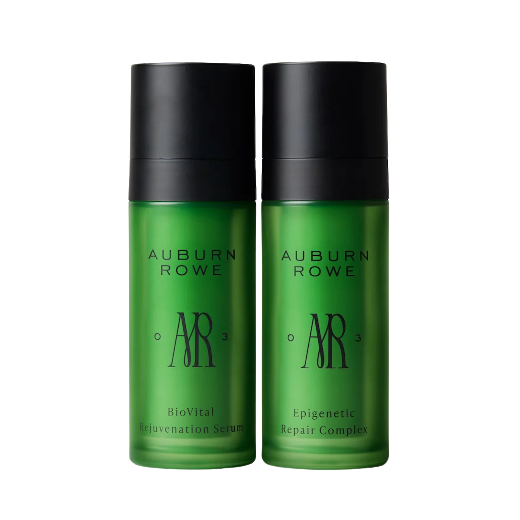 Two green bottles with black caps labeled 'Auburn Rowe' on a white background