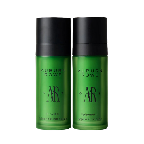 Two green bottles with black caps labeled 'Auburn Rowe' on a white background