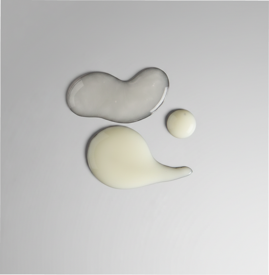Three abstract ceramic shapes on a gray background