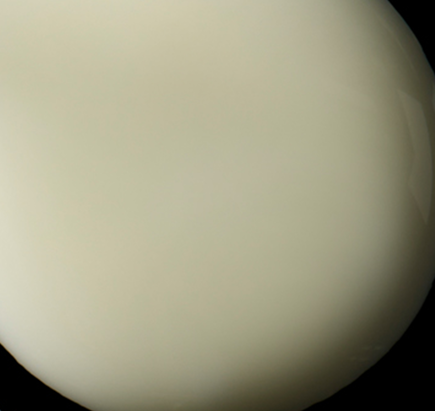 Close-up of a planet with a beige color on a black background