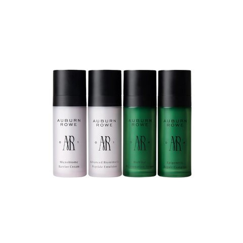 Four bottles of Auburn Rowe skincare products on a white background